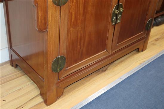 A Chinese padouk wood cabinet W.124cm